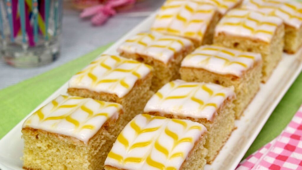 Slices of Lemon Easter Traybake on a white plate
