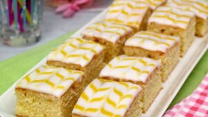 Slices of Lemon Easter Traybake on a white plate